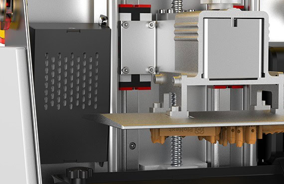 Imagen de una célula de impresión 3D utilizada en odontología, con componentes mecánicos y electrónicos para crear modelos dentales precisos.