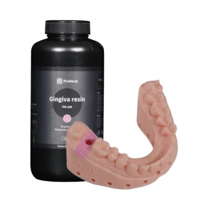 Bote de gingiva resin y una prótesis dental en forma de arco en la imagen, utilizados en tratamientos odontológicos para restaurar encías y estructuras dentales.